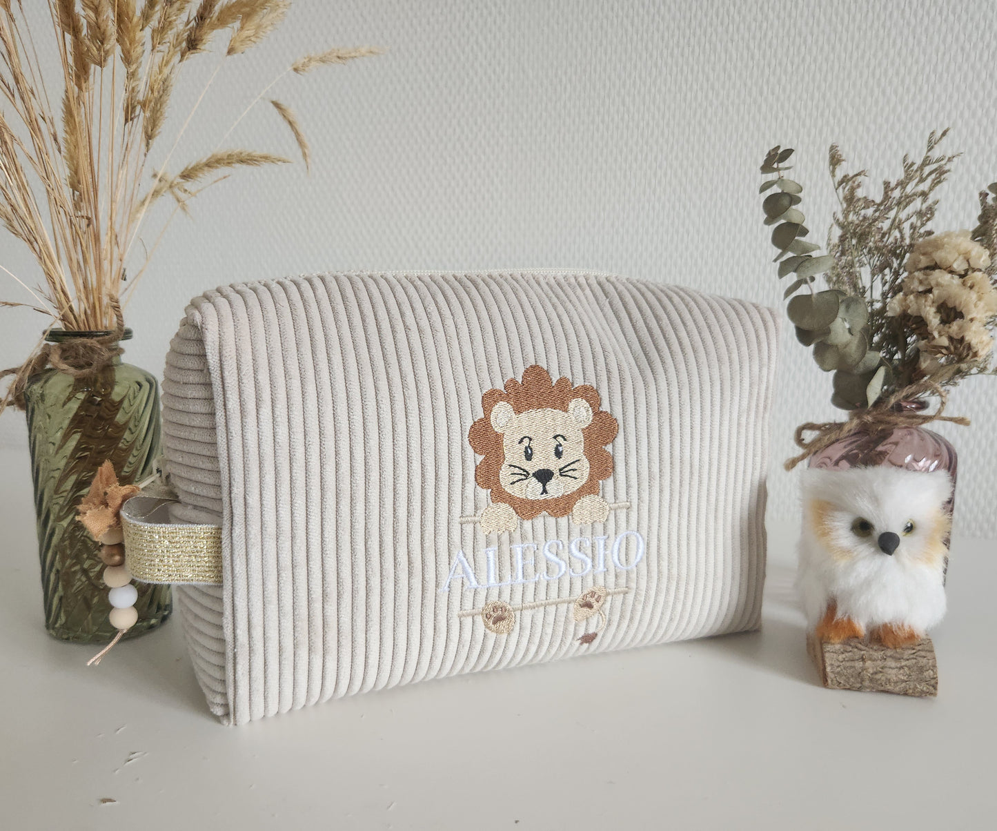 Trousse de toilette en velours côtelé et broderie lion