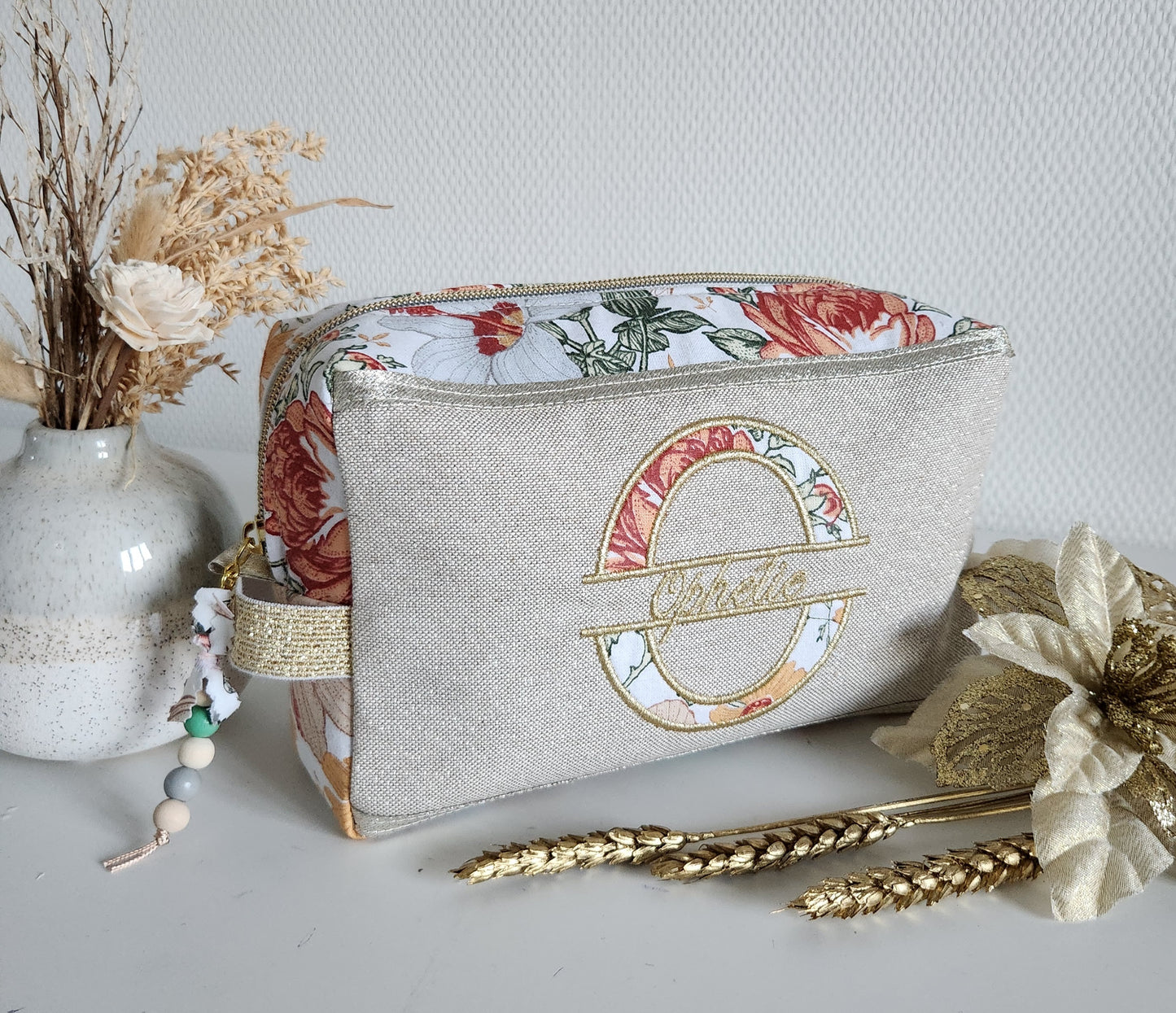 Trousse de toilette beige scintillant et fleurs d'automne