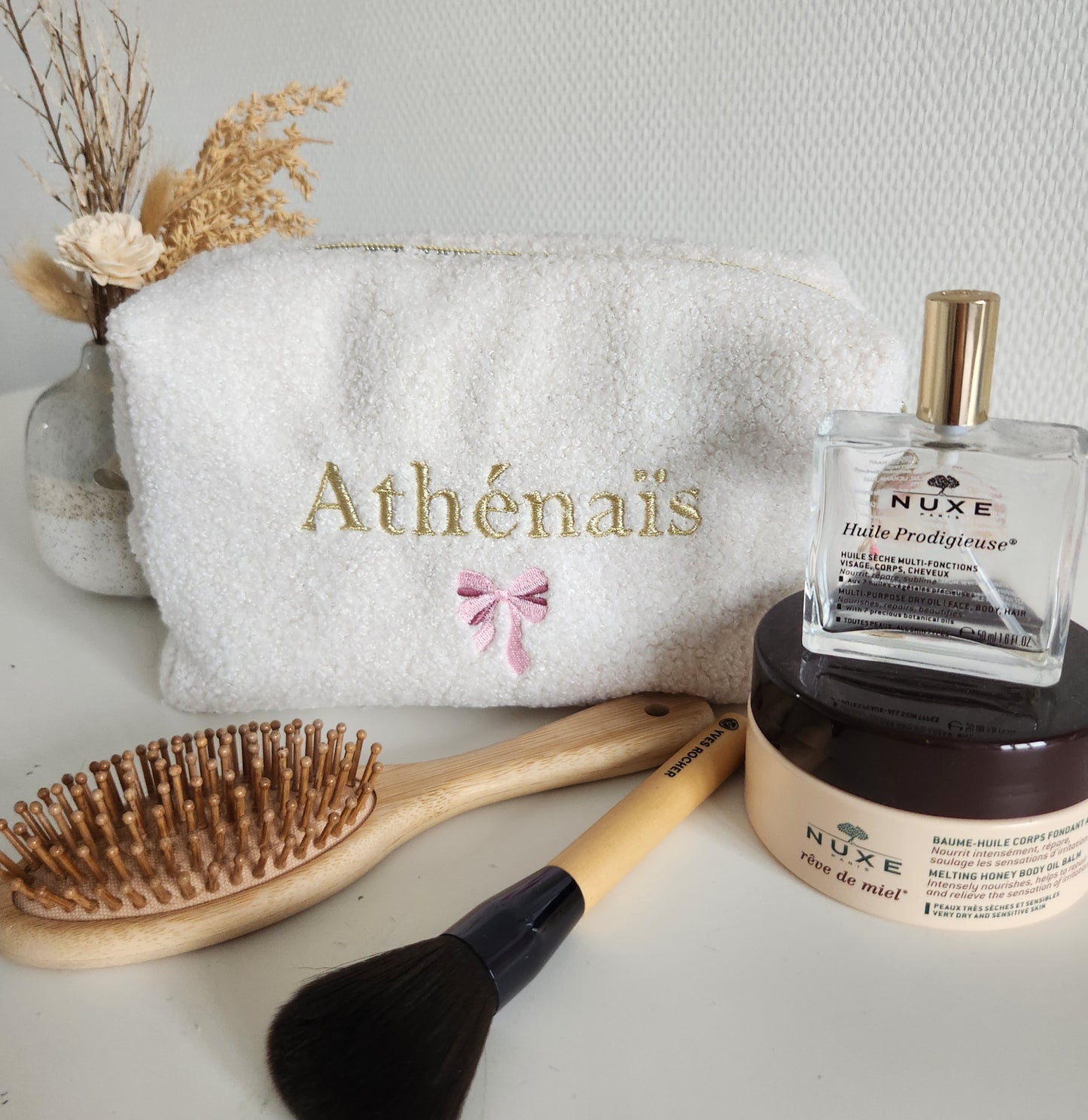 Trousse de toilette brodée en moumoute bouclette