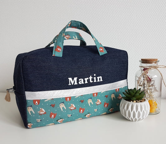 Two-tone denim and animal suitcase.