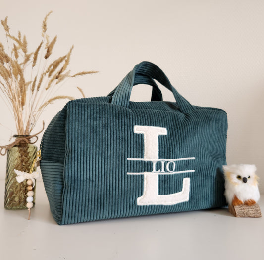 Corduroy suitcase and ecru fur letter