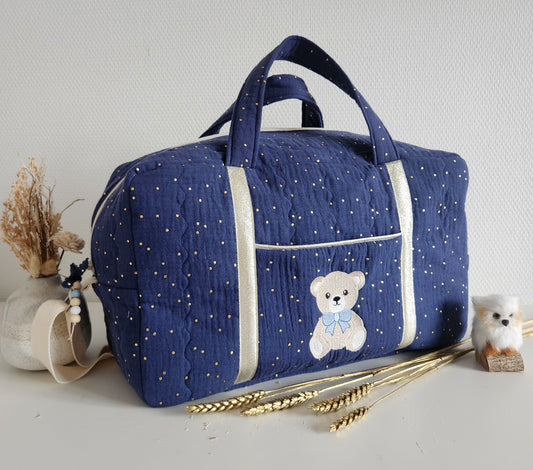 Gesteppte Wickel- oder Reisetasche, doppelte Baumwollgaze mit goldenen Punkten.