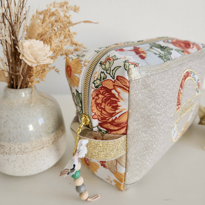 Trousse de toilette beige scintillant et fleurs d'automne