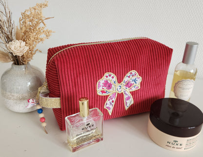 Trousse de toilette motif noeud en velours côtelé