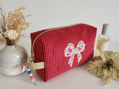 Trousse de toilette motif noeud en velours côtelé