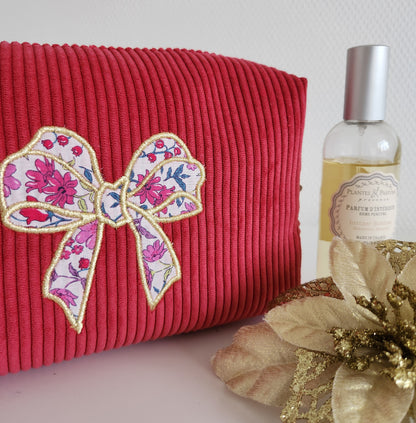 Trousse de toilette motif noeud en velours côtelé