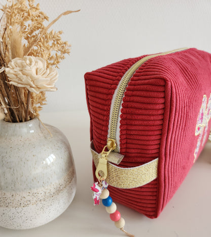 Trousse de toilette motif noeud en velours côtelé