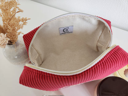 Trousse de toilette motif noeud en velours côtelé